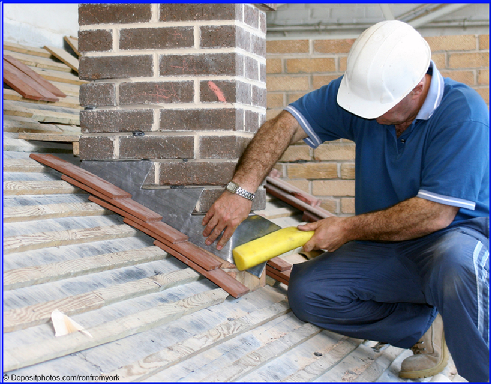 Image of roofer working on chimney flashing.